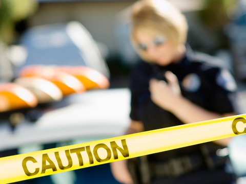 Police Woman Using Two-Way Radios